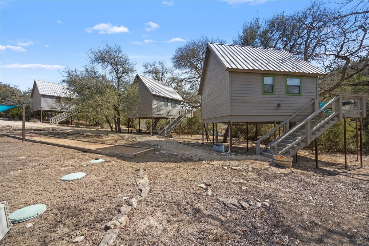 View 931 Sycamore Creek Dr in Creekside Add 931 Sycamore Creek Dr - front exterior - Luxury home in Creekside Add, Dripping Springs, TX