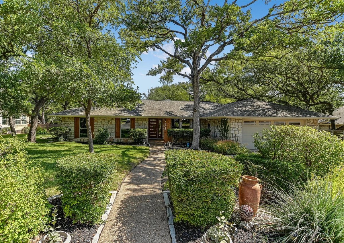 View 9404 Topridge Dr in Spicewood Estates Sec 01 9404 Topridge Dr - front exterior - Luxury home in Spicewood Estates Sec 01, Austin, TX