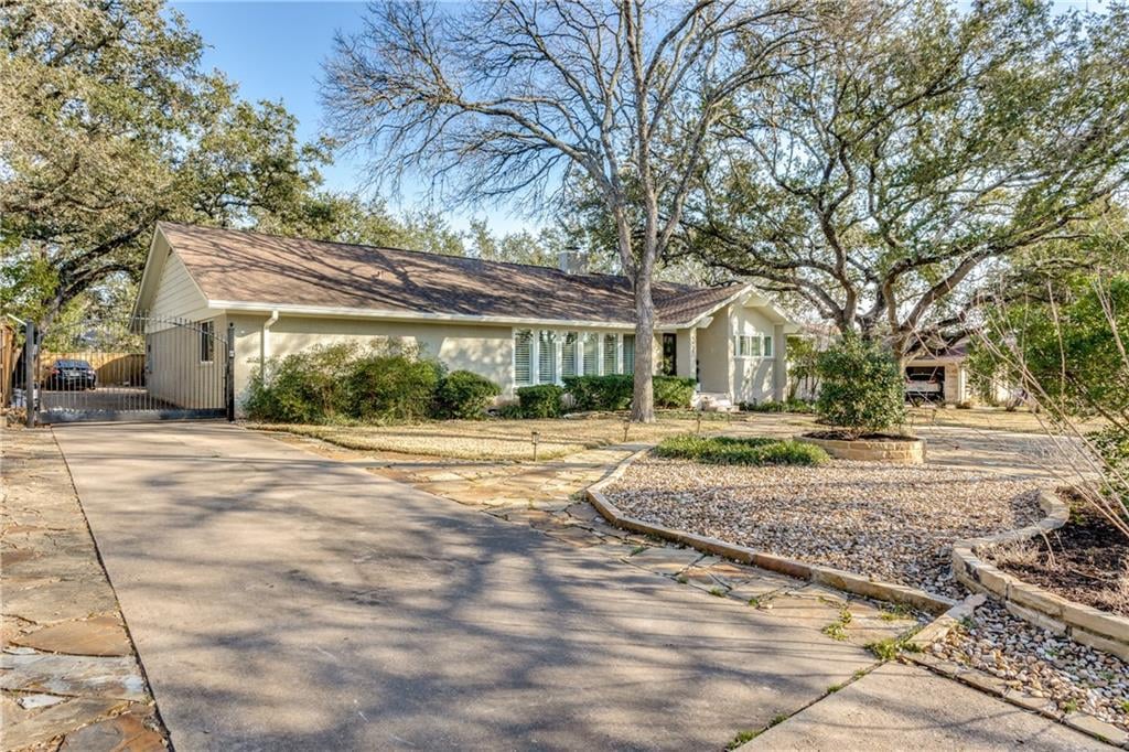 View 9405 Spring Hollow Dr in Balcones Village 9405 Spring Hollow Dr - front exterior - Luxury home in Balcones Village, Austin, TX