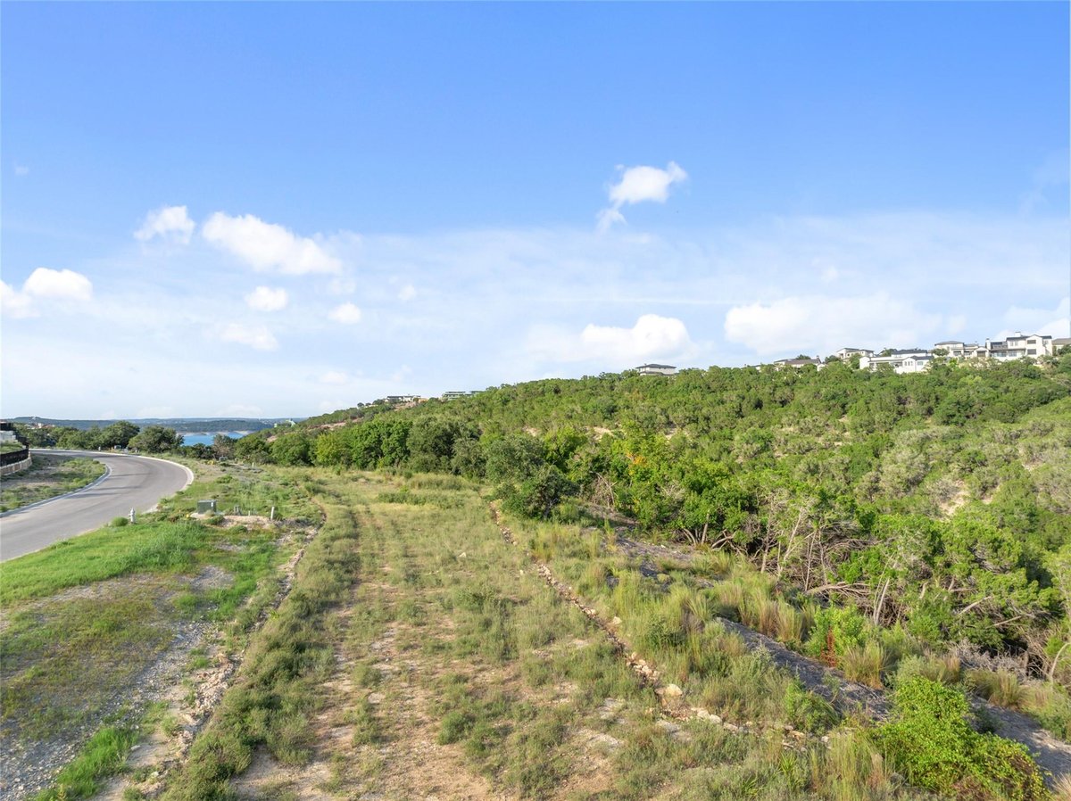 Primary bedroom at 961 Tomichi Trl - Rough Hollow- Las Brisas Estates, Lakeway, TX