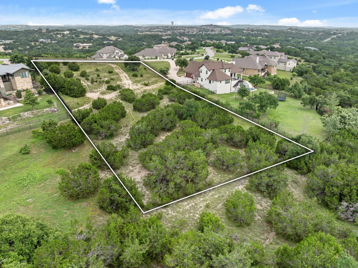974 Bluff Woods Dr - front exterior - Luxury lot in RIM ROCK PHASE TWO SEC TWO, BLOCK A, Lot 28, ACRES, Driftwood, TX