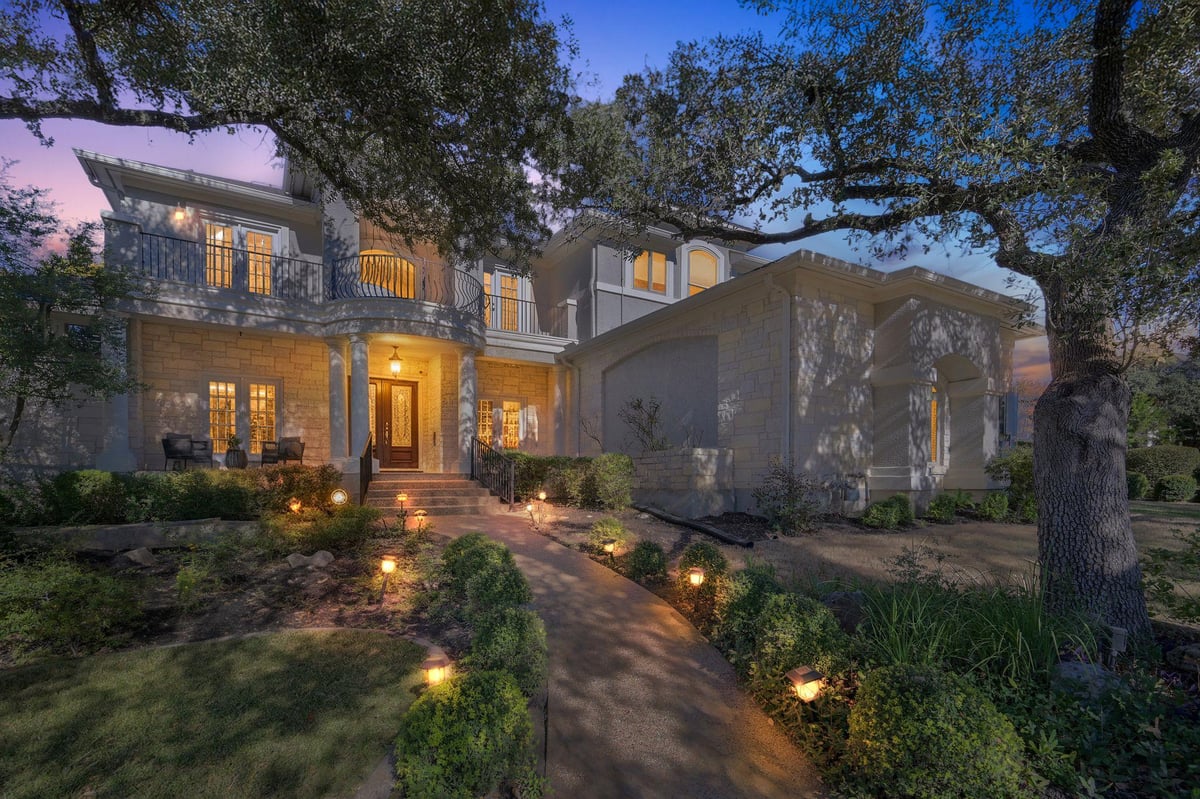 View 9808 Tree Bend Cv in Spicewood At Bullcreek Sec 03 Ph B 9808 Tree Bend Cv - front exterior with twilight estate facade - Luxury home in Spicewood At Bullcreek Sec 03 Ph B, Austin...