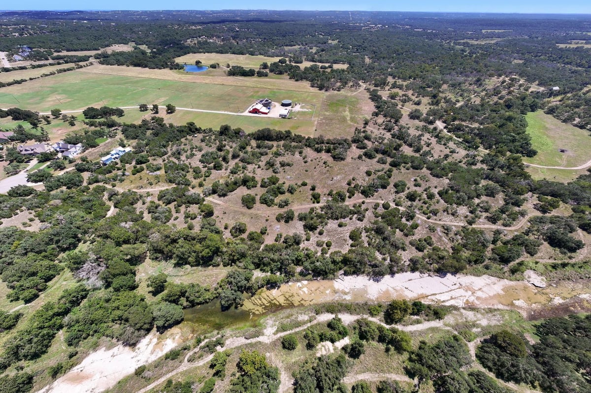 TBD 16+/- acres Trebled Waters Trl - front exterior - Luxury home in Howard Ranch Sec 2, Driftwood, TX