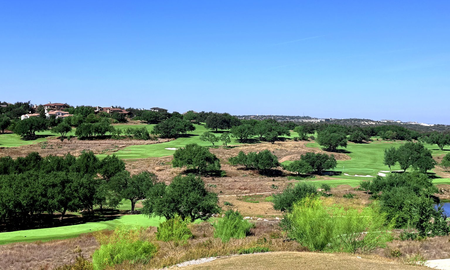 Spanish Oaks golf fairways with live oaks and Hill Country