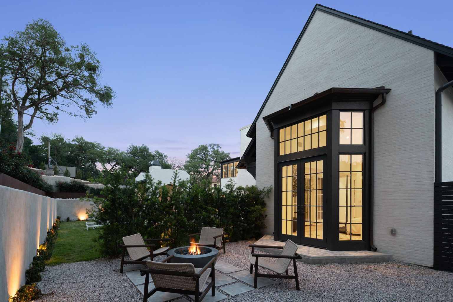The Lantern luxury estate front entry patio at twilight, 3802 Balcones Drive Austin