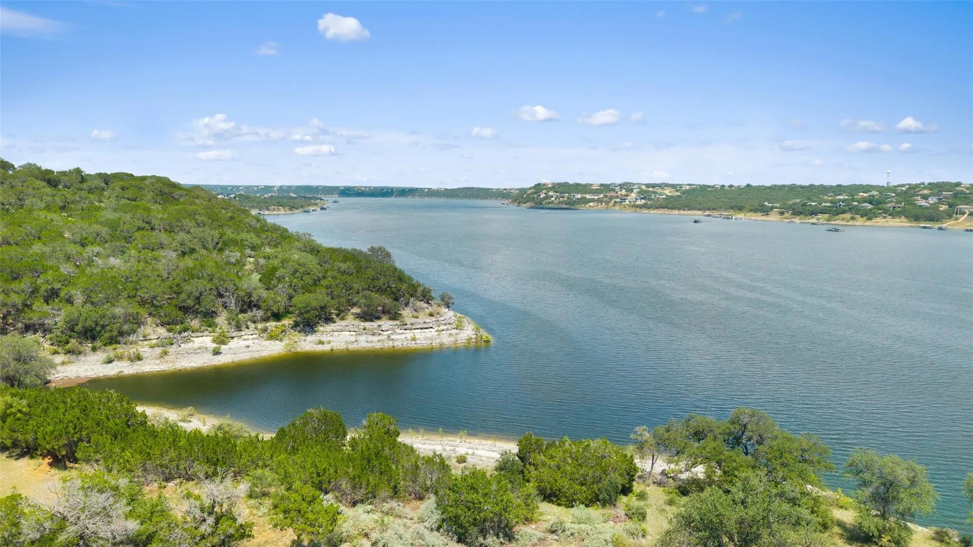 Lake Travis and its wooded limestone shoreline seen from the hills above Lakeway