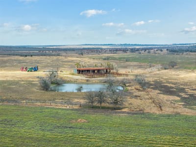Aerial view with expansive Hill Country acreage at 000 Political Rd - N/A, Lockhart, TX