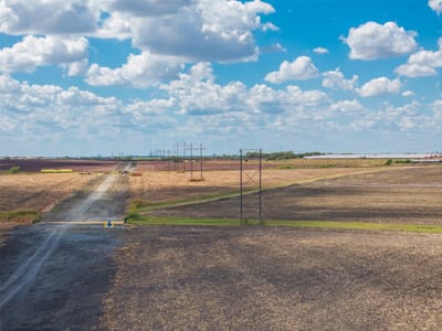 View with rural road frontage and open farm fields at 000 Wells Ln - N/A, Manor, TX