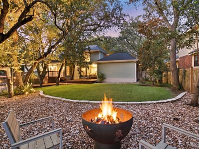 Backyard with fire pit and twilight lighting at 10038 Circleview DR - 4 bed 3 bath home