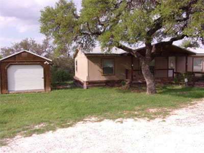 Primary bedroom at 10060 Rebecca Creek Rd - 3 bed 2 bath home
