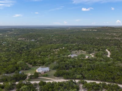 Primary bedroom at 102 Rocky Creek RD - Bell Spgs Ranches, Dripping Springs, TX