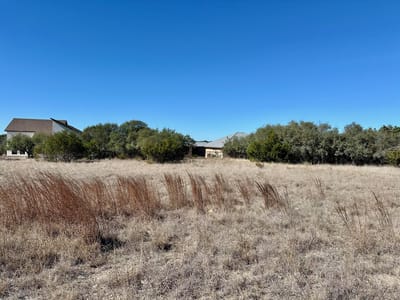 Primary bedroom at 107 N Jesse Stiff - Rockin J Ranch, Blanco, TX