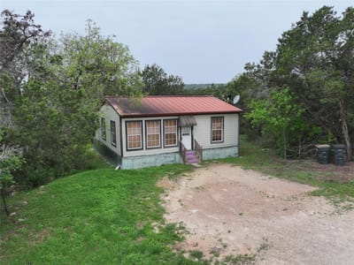 Primary bedroom at 110 Roadrunner Rd Unit #A & B + buildable acreage - Rocky Ranch Acres Sec 2, San Marcos, TX