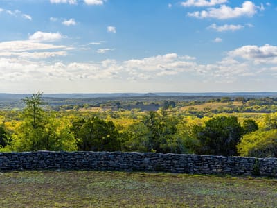 View with long-distance Hill Country view at 1100 Pump Station Rd - none, Wimberley, TX