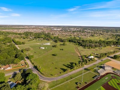 Aerial view with expansive acreage and Hill Country views at 1218  Lovers Ln - Austin, Stephen F, Bastrop, TX