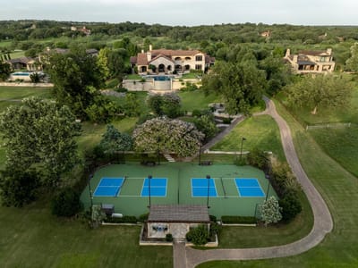Aerial view - 13322 Shore Vista Dr Aerial view with estate aerial with tennis court at 13322 Shore Vista Dr - 5 bed 7 bath home