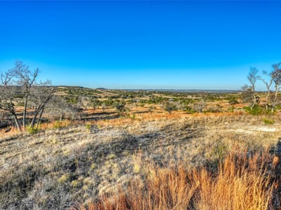 Primary bedroom at 136 & 137 Falling Oak Dr - MAJESTIC HILLS RANCH, Blanco, TX
