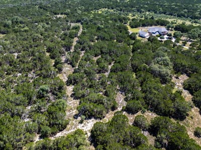 Primary bedroom at 140 Cave Springs Rd - LOST SPRINGS, Wimberley, TX