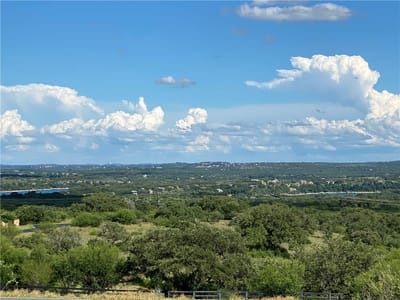 Primary bedroom at 1401 Majestic Hills BLVD - Barton Creek Lakeside Ph 01, Spicewood, TX