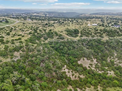 Primary bedroom at 144 Cherokee Rdg - Ranches At Canyon Creek, Bertram, TX
