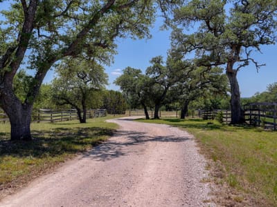 Primary bedroom at 15425 Fitzhugh RD - John Barton, Dripping Springs, TX