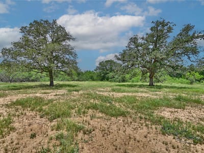 Primary bedroom at 159 Starlight Path - Blue Sky Estates, Red Rock, TX