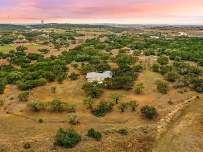 Aerial view - 1800 E 290 Hwy Aerial view with drone aerial at sunset at 1800 E 290 Hwy - Dripping Springs, TX