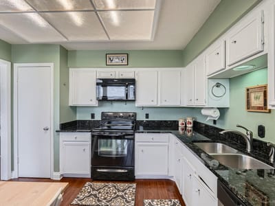 Kitchen at 204 World Of Tennis Sq Unit #C15 - 4 bed 4 bath home