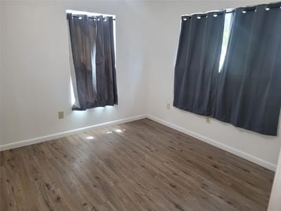 Primary bedroom at 205 2nd Ave Unit #1 & 2 - Mt Pleasant, Smithville, TX