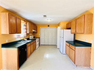 Living area at 2105 W Gillis Ave - 4 bed 2 bath home