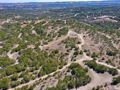 Primary bedroom at 21524 Kathy Ln - Beaty Seale & Forwood Surv #45, Spicewood, TX