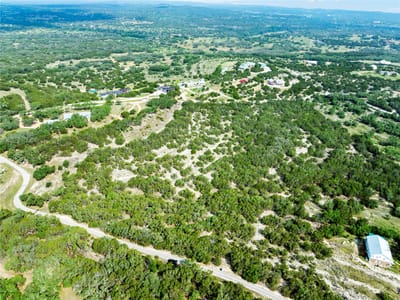 Primary bedroom at 23519 Pedernales Canyon TRL Unit #6 - Edward Gritten League, Spicewood, TX