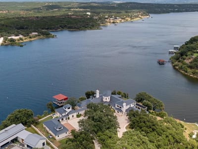 Aerial view with lakefront peninsula property at 26100 Countryside DR - 5 bed 5 bath home