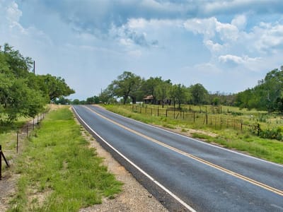 Front exterior with Rural Hill Country setting at 2700 County Road 245 - 0, Florence, TX