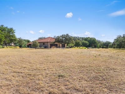 Primary bedroom at 27509 Waterfall Hill PKWY - Barton Creek Lakeside, Spicewood, TX