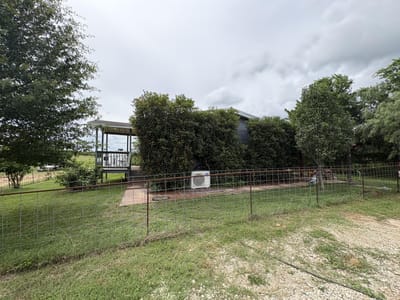 Primary bedroom at 2990 S 304 Highway - 2 bed 2 bath home