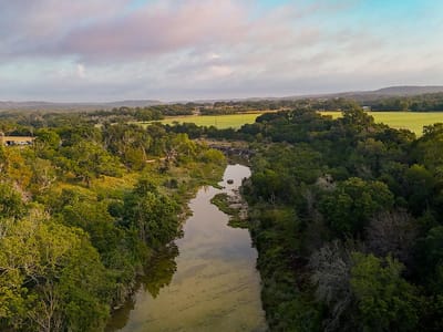 Aerial view with Hill Country river views at 3067 Ranch Road 1888 - None, Blanco, TX