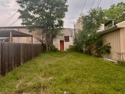 Primary bedroom at 308 S Main St - Peter Kerr Por, Burnet, TX