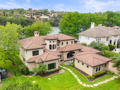 Front exterior with Mediterranean-style front elevation at 3104 Rivercrest DR - 4 bed 5 bath home