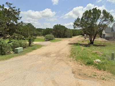 Primary bedroom at 33 Meadow Oak Ct - Woodcreek Sec 12, Wimberley, TX