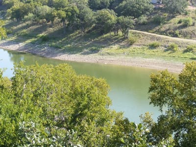 Primary bedroom at 3705 1/2 N Peninsular Dr - Singleton Bend, Marble Falls, TX