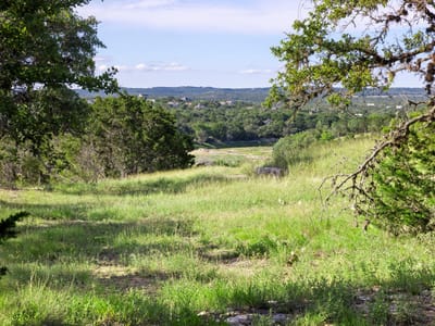 Primary bedroom at 4 Shilo CV - Woodcreek, Wimberley, TX