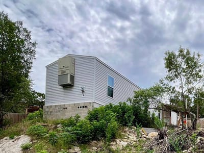 Primary bedroom at 407 Rockport Dr - Lake View Park, Canyon Lake, TX