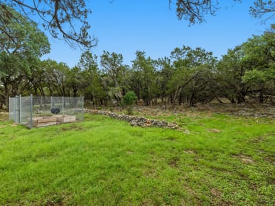 Primary bedroom at 410 Cedar Bend Rd - Burnett Ranch Sec 2, Wimberley, TX