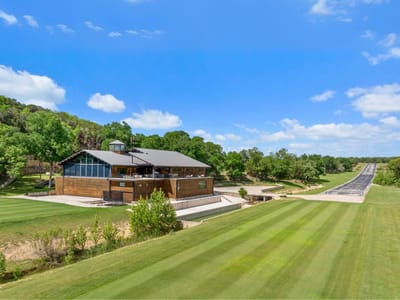 Front exterior with Modern architectural design with wood si at 5055 Wayside Dr - None, Wimberley, TX