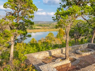 Patio with stone overlook terrace and lake view at 518 Curly H Ranch Rd - 3 bed 2 bath home