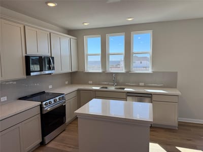 Kitchen at 5900 Whisper Creek Dr Unit #418 - 3 bed 2 bath home