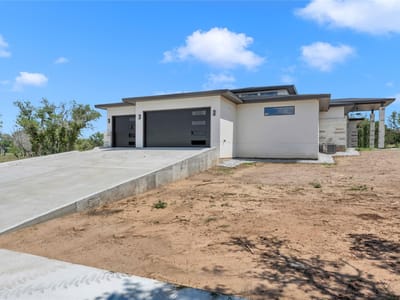 Primary bedroom at 6507 Ranch Rd 962 W - 4 bed 4 bath home