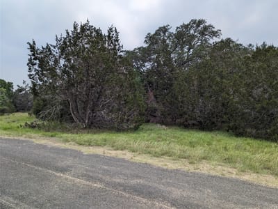 Primary bedroom at 73 E Valley Spring Rd - Woodcreek Sec 9-A, Wimberley, TX