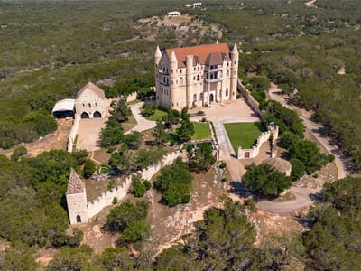 Aerial view with Castle architecture at 7400 Park Road 4 S - 7 bed 4 bath home